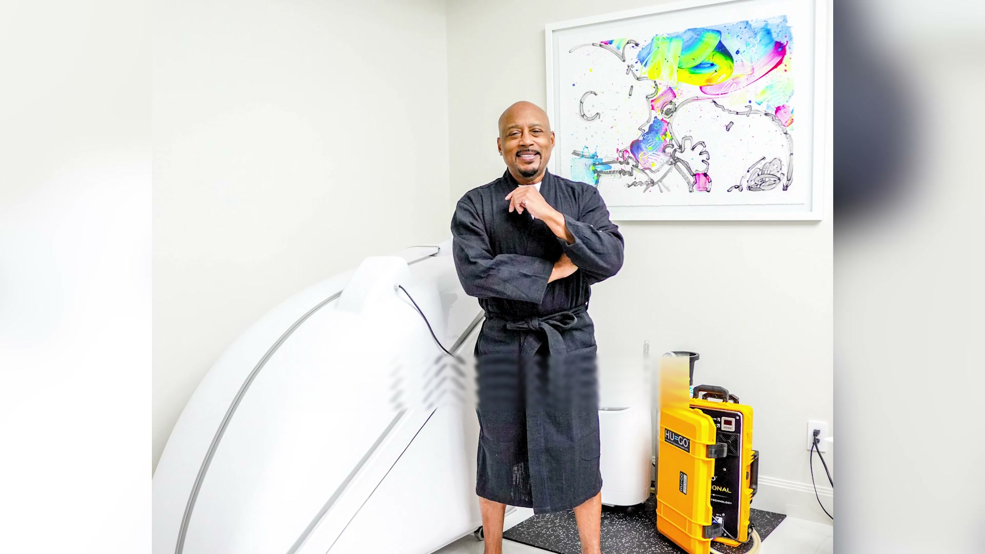 Daymond John next to his HOCATT chamber